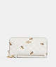 COACH®,LONG ZIP AROUND WALLET IN SIGNATURE CANVAS WITH BEE PRINT,Coated Canvas/Leather,Mini,Gold/Chalk/Glacier White Multi,Front View