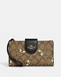 COACH®,PHONE WALLET IN SIGNATURE CANVAS WITH BEE PRINT,Coated Canvas/Leather,Gold/Khaki Multi,Front View