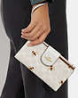 COACH®,PHONE WALLET IN SIGNATURE CANVAS WITH BEE PRINT,Coated Canvas/Leather,Gold/Chalk/Glacier White Multi,Detail View