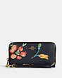 COACH®,LONG ZIP AROUND WALLET WITH DREAMY LAND FLORAL PRINT,Leather,Mini,Gold/Midnight Multi,Front View