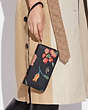 COACH®,LONG ZIP AROUND WALLET WITH DREAMY LAND FLORAL PRINT,Leather,Mini,Gold/Midnight Multi,Detail View