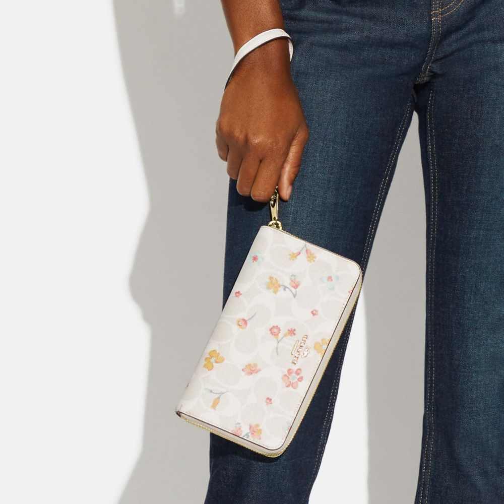 COACH® | Long Zip Around Wallet In Signature Canvas With Mystical