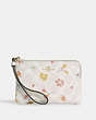 COACH®,CORNER ZIP WRISTLET IN SIGNATURE CANVAS WITH MYSTICAL FLORAL PRINT,Gold/Chalk Multi,Front View