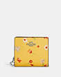 COACH®,SNAP WALLET WITH MYSTICAL FLORAL PRINT,Mini,Silver/Yellow Multi,Front View