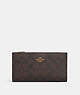 COACH®,SLIM ZIP WALLET IN SIGNATURE CANVAS,pvc,Gold/Brown Black,Front View