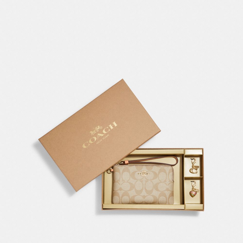 COACH®,BOXED CORNER ZIP WRISTLET IN SIGNATURE CANVAS,Logo PVC,Mini,Gold/Light Khaki/Faded Blush,Front View