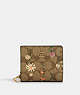 COACH®,SNAP WALLET IN SIGNATURE CANVAS WITH WILDFLOWER PRINT,Coated Canvas/Leather,Mini,Gold/Khaki Multi,Front View