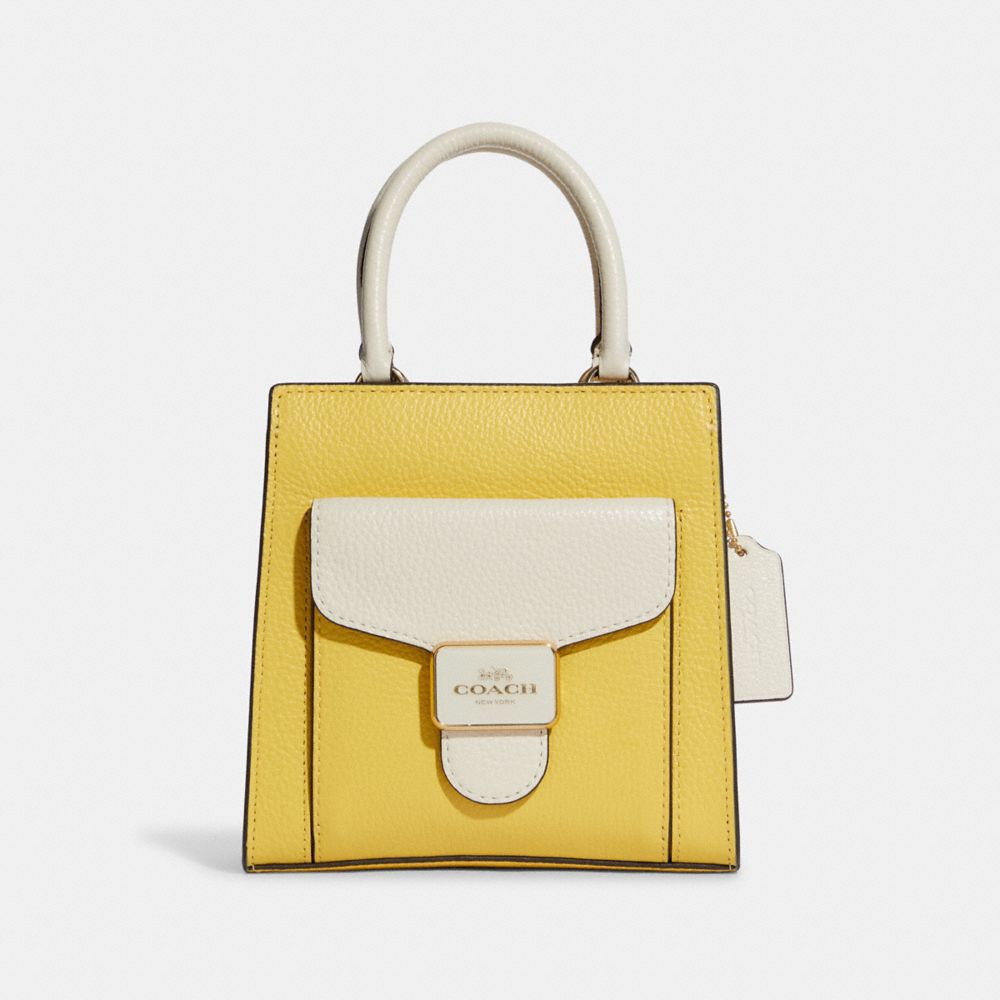 Small yellow best sale coach purse