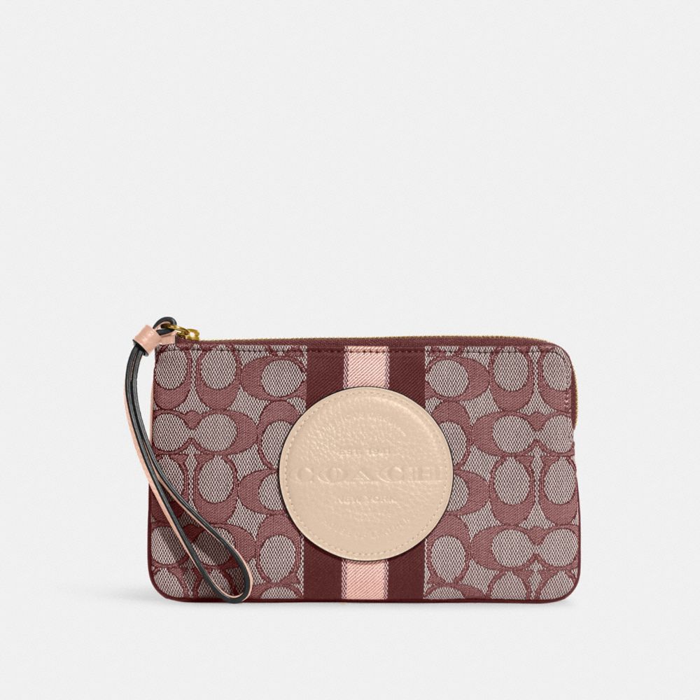 COACH®,DEMPSEY LARGE CORNER ZIP WRISTLET IN SIGNATURE JACQUARD WITH STRIPE AND COACH PATCH,Medium,Gold/Wine Multi,Front View