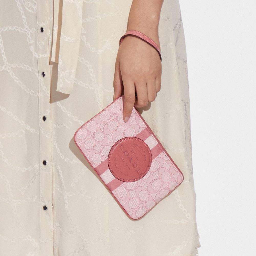 COACH®,Dempsey Large Corner Zip Wristlet In Signature Jacquard With Stripe And Coach Patch,,Detail View