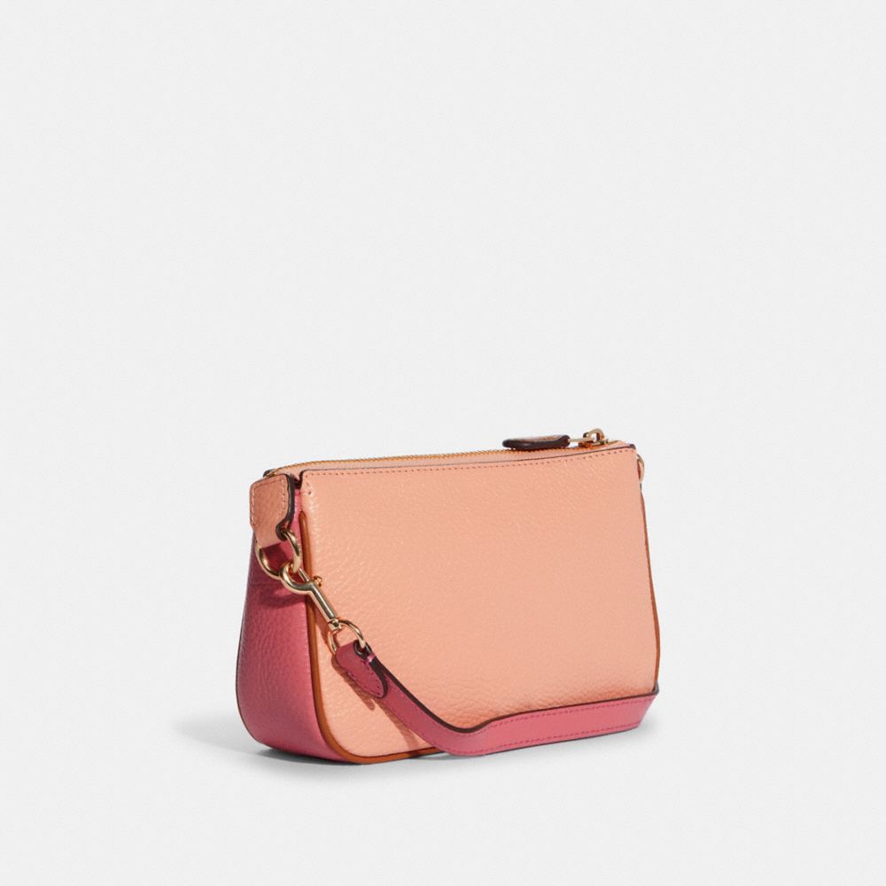 COACH Nolita Wristlet 15 In Pebble Leather in Pink