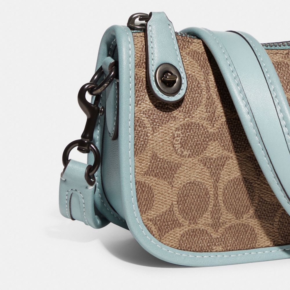 COACH® | Swinger 20 In Signature Canvas