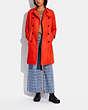 COACH®,ICON TRENCH COAT IN ORGANIC COTTON AND RECYCLED POLYESTER,Organic Cotton,Orange,Scale View