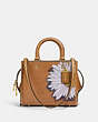 COACH®,COACH X KŌKI, ROGUE BAG 25 IN ORIGINAL NATURAL LEATHER WITH DAISY,Leather,Medium,Brass/Turmeric Nut,Front View