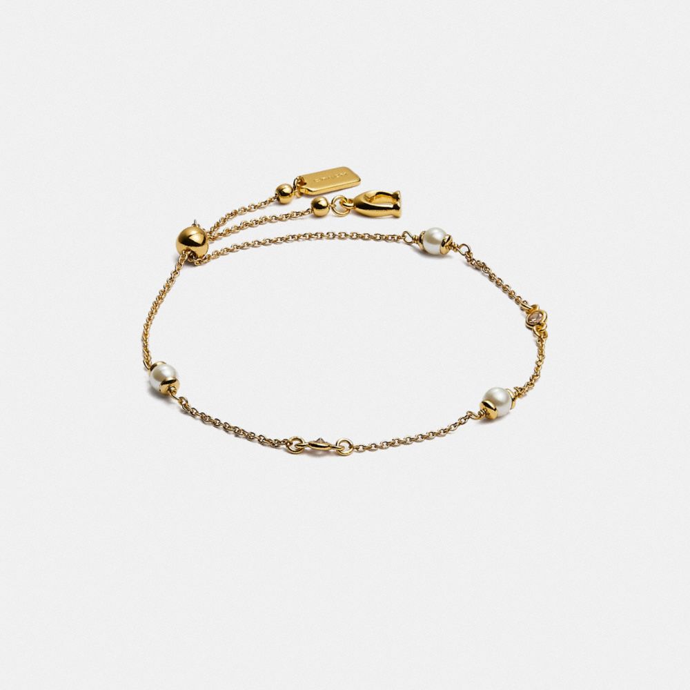 COACH®,CLASSIC CRYSTAL PEARL SLIDER BRACELET,Brass,Gold,Front View