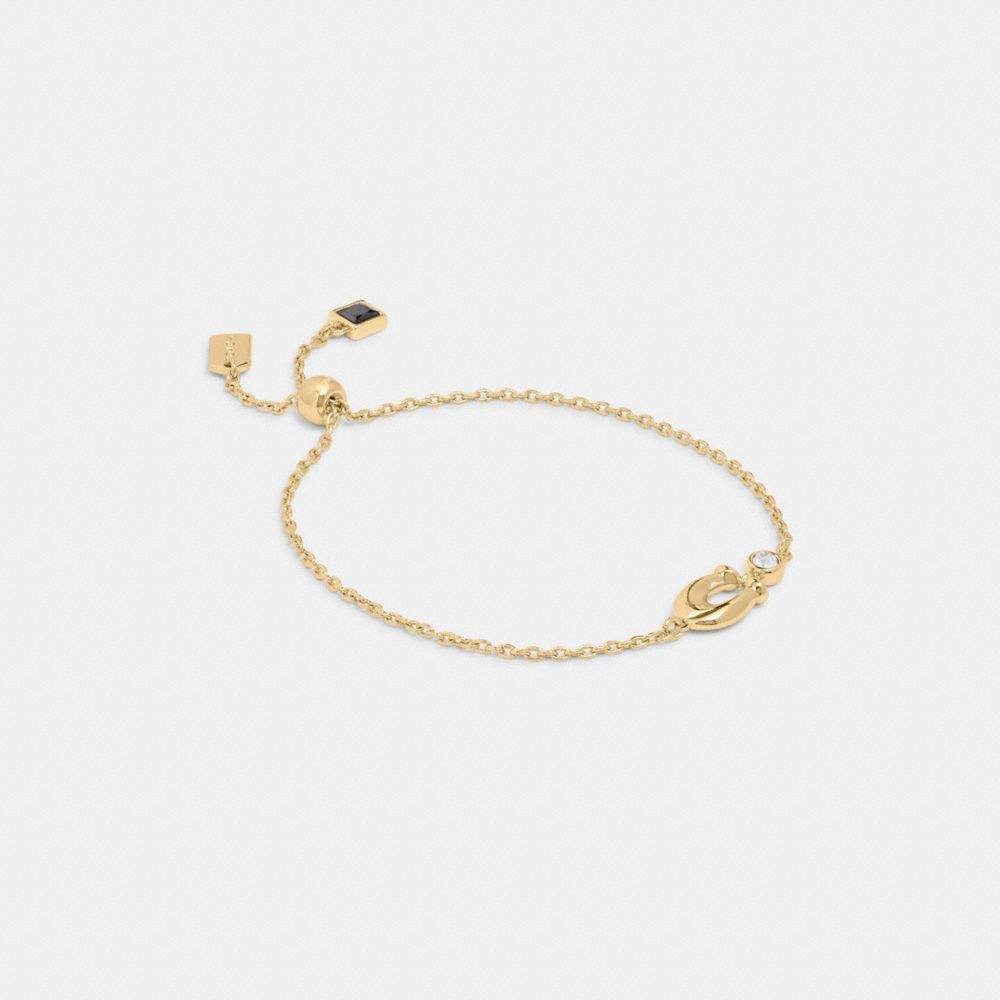 COACH®,シグネチャー クリスタル スライダー ブレスレット,ブレスレット＆バングル,ｺﾞｰﾙﾄﾞ/ｸﾘｱ