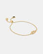 COACH®,SIGNATURE CRYSTAL SLIDER BRACELET,Plated Brass,Mini,Gold/Clear,Front View