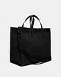 COACH®,FIELD TOTE BAG 40 IN ORGANIC COTTON CANVAS WITH COACH BADGE,canvas,X-Large,Black Copper/Black,Angle View
