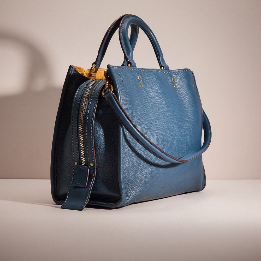 COACH®,Restored Rogue,Leather,Suede,Satchel,Metal Material,Stitching,Adjustable,Sustainable,Brass,Day Party,Blue,Angle View