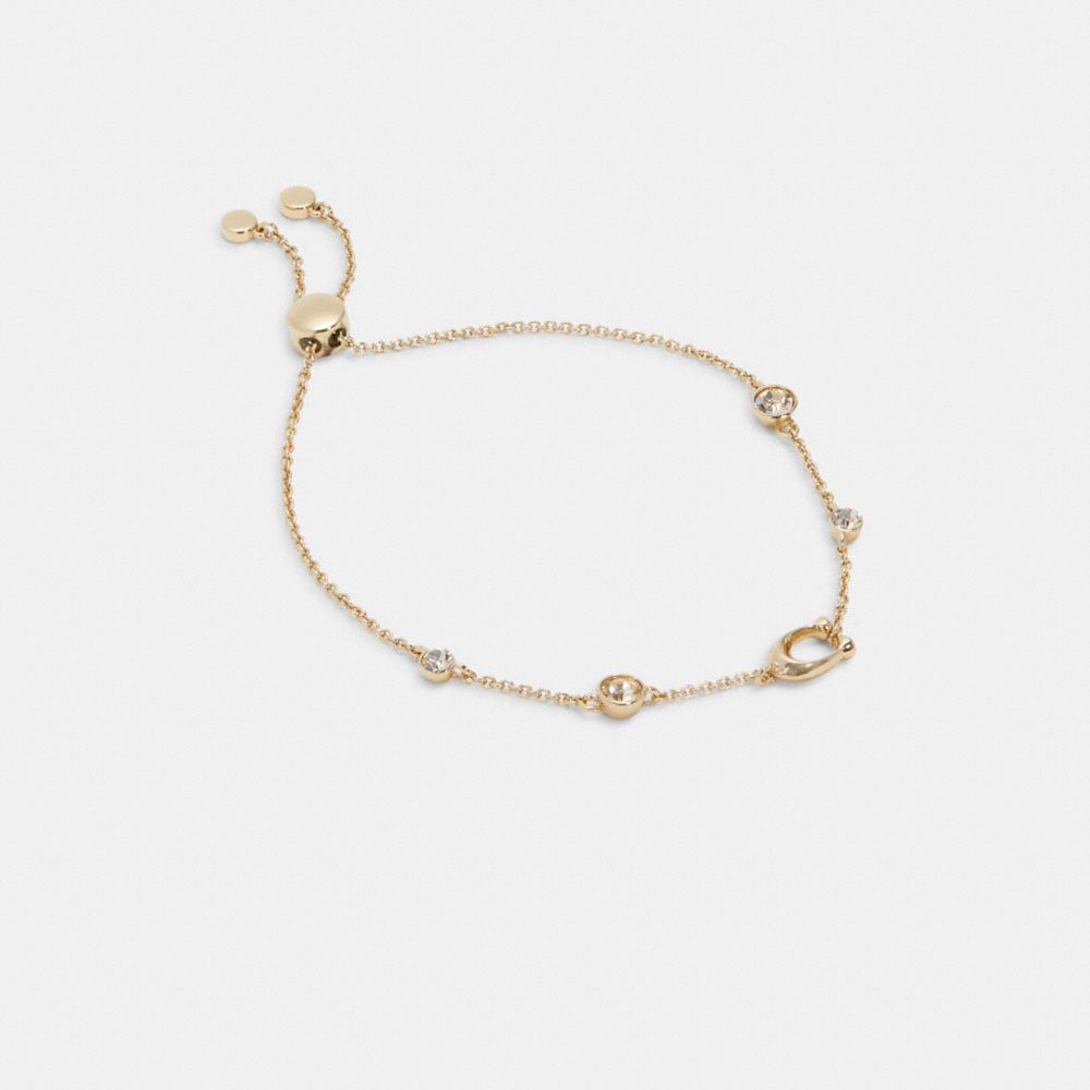 COACH®,SIGNATURE CRYSTAL SLIDER BRACELET,Gold,Front View