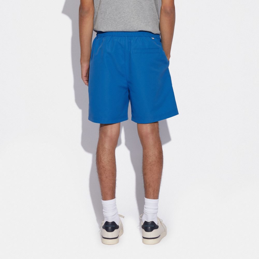 COACH®,Magic Print Signature Swim Trunks,,Scale View