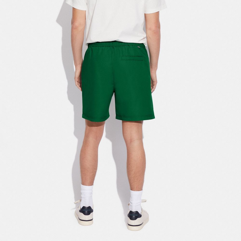 COACH®,Magic Print Signature Swim Trunks,,Scale View