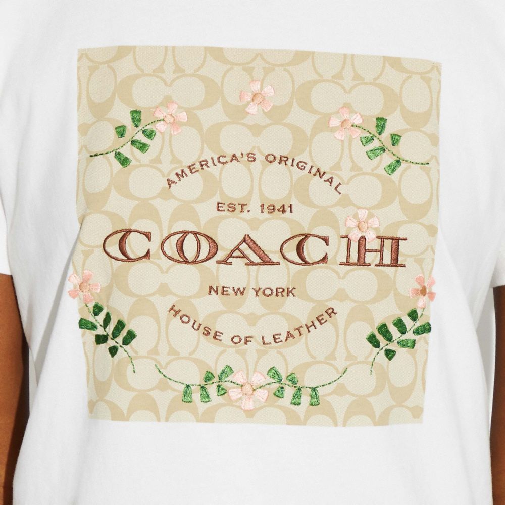 COACH SIGNATURE EMBOSSED FLORAL DESIGN WHITE WOMAN T-SHIRT SIZE L NEW WITH  TAG