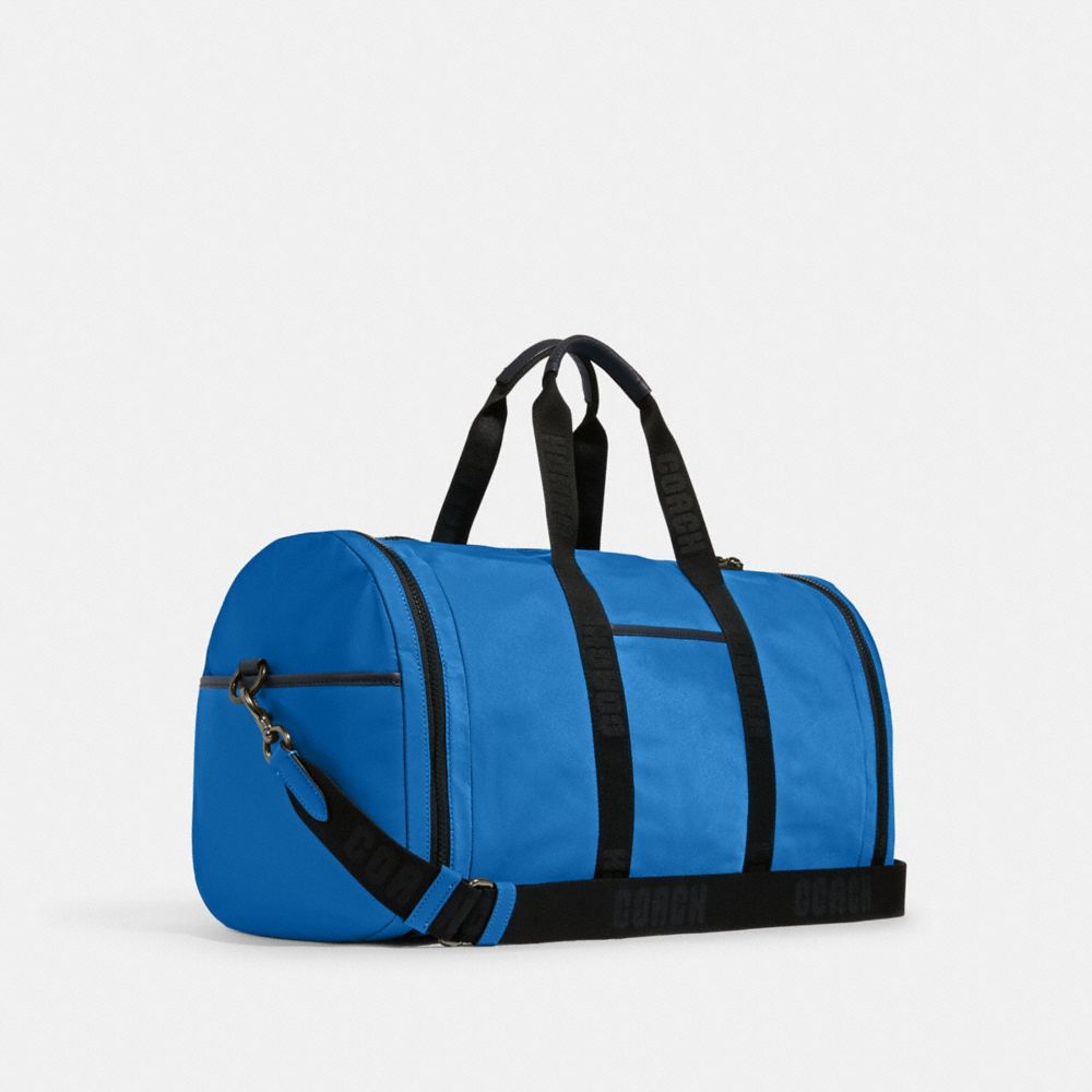 COACH®,SAC DE SPORT MAX,Nylon,Bronze industriel/Bleu vif,Angle View