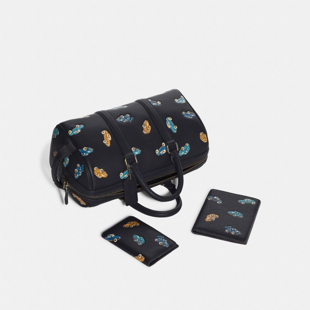 COACH®,Venturer Crossbody 27 With Car Print,,Angle View