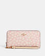 COACH®,LONG ZIP AROUND WALLET WITH GRAPHIC DITSY FLORAL PRINT,Mini,Gold/Pink Multi,Front View
