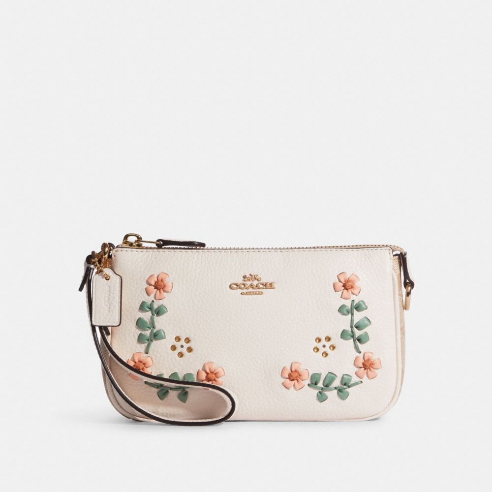 Signature Canvas Nolita 19 Wristlet