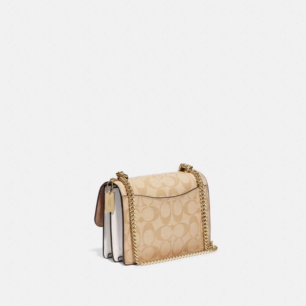 COACH®,MINI KLARE CROSSBODY IN SIGNATURE CANVAS,Signature Canvas,Anniversary,Gold/Light Khaki Chalk,Angle View