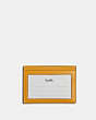 COACH®,SLIM ID CARD CASE,Cuir de veau raffiné,Bronze industriel/Jaune moutarde,Back View