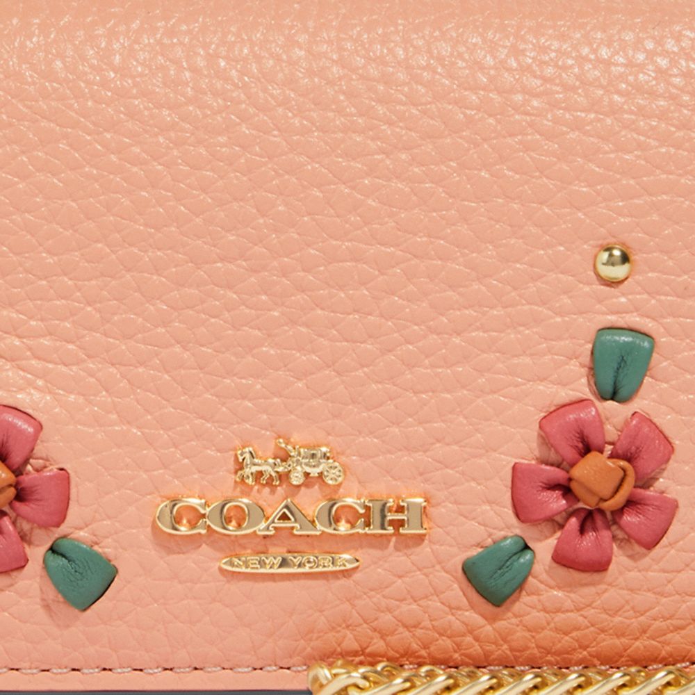 Coach pink best sale floral wallet