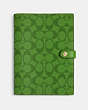 COACH®,NOTEBOOK IN COLORBLOCK SIGNATURE CANVAS,Neon Green,Front View
