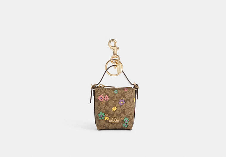 COACH®,MINI VAL DUFFLE BAG CHARM IN SIGNATURE CANVAS WITH SPACED FLORAL PRINT,Gold/Khaki Purple Multi,Front View