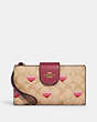 COACH®,PHONE WALLET IN SIGNATURE CANVAS WITH STRIPE HEART PRINT,Gold/Light Khaki Multi,Front View