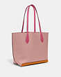 COACH®,KIA TOTE IN COLORBLOCK,Natural Pebble Leather,Medium,Brass/Carnation Multi,Angle View