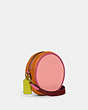 COACH®,KIA CIRCLE BAG IN COLORBLOCK,Natural Pebble Leather,Small,Brass/Carnation Multi,Angle View