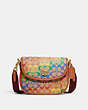 COACH®,WILLOW SADDLE BAG IN RAINBOW SIGNATURE CANVAS,Signature Coated Canvas/Leather,Small,Brass/Tan Hazelnut Multi,Front View