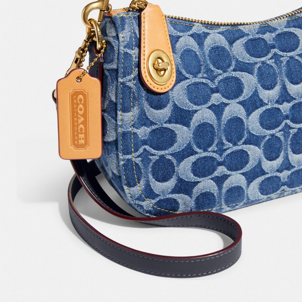 Blue jean store coach purse