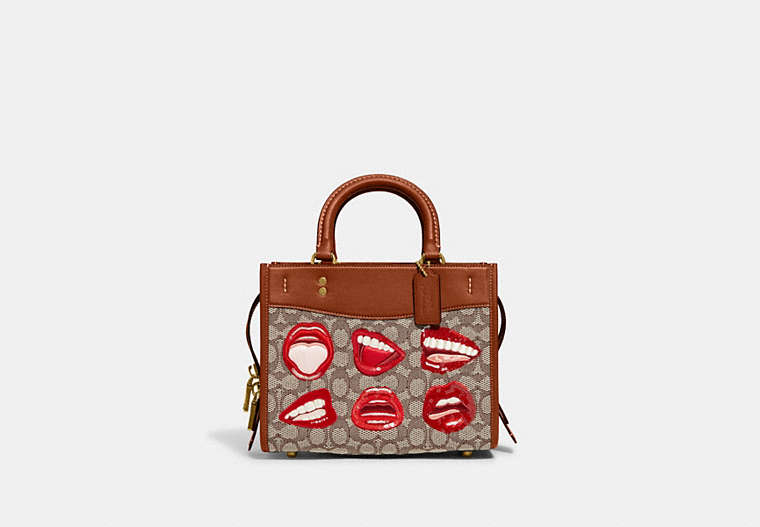 COACH®,COACH X TOM WESSELMANN ROGUE 25 IN SIGNATURE TEXTILE JACQUARD,Signature Jacquard,Medium,Brass/Cocoa Burnished Amb,Front View