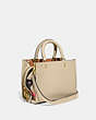 COACH®,COACH X TOM WESSELMANN ROGUE BAG 25,Glovetanned Leather,Medium,Brass/Ivory,Angle View