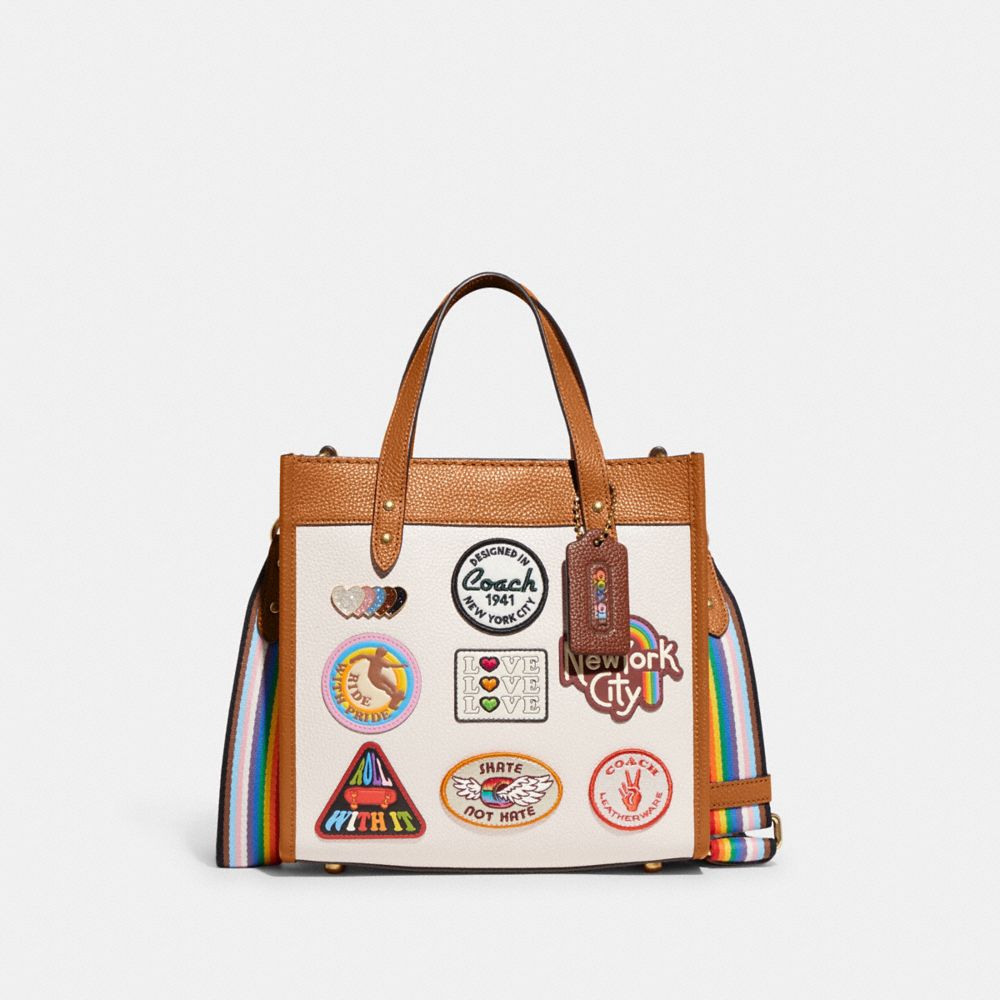 COACH®,FIELD TOTE 22 WITH PATCHES,Pebble Leather,Medium,Brass/Chalk Multi,Front View
