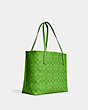 COACH®,CITY TOTE IN BLOCKED SIGNATURE CANVAS,X-Large,Im/Neon Green,Angle View