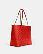 COACH®,CITY TOTE BAG IN BLOCKED SIGNATURE CANVAS,X-Large,Im/Miami Red,Angle View