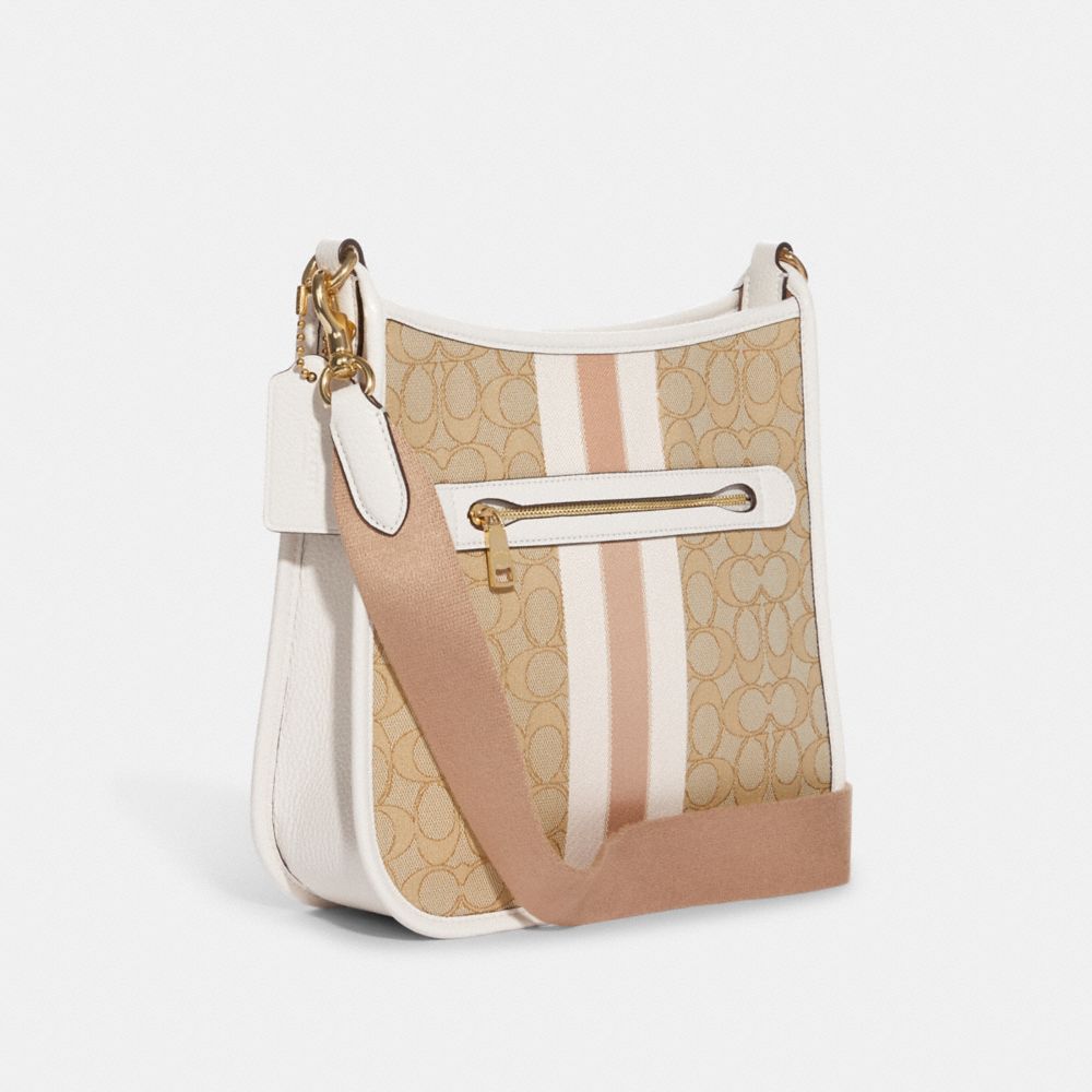 COACH®,Dempsey File Bag In Signature Jacquard With Stripe And Coach Patch,,Angle View