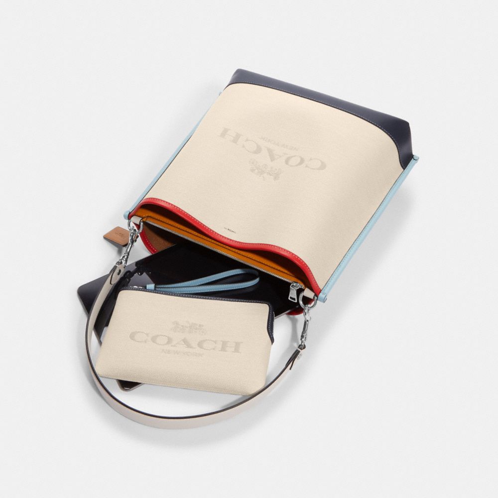 COACH®,Mollie Bucket Bag In Colorblock,,Angle View