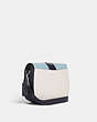 COACH®,GEORGIE SADDLE BAG IN COLORBLOCK,Refined Pebble Leather,Medium,Silver/Chalk Multi,Angle View