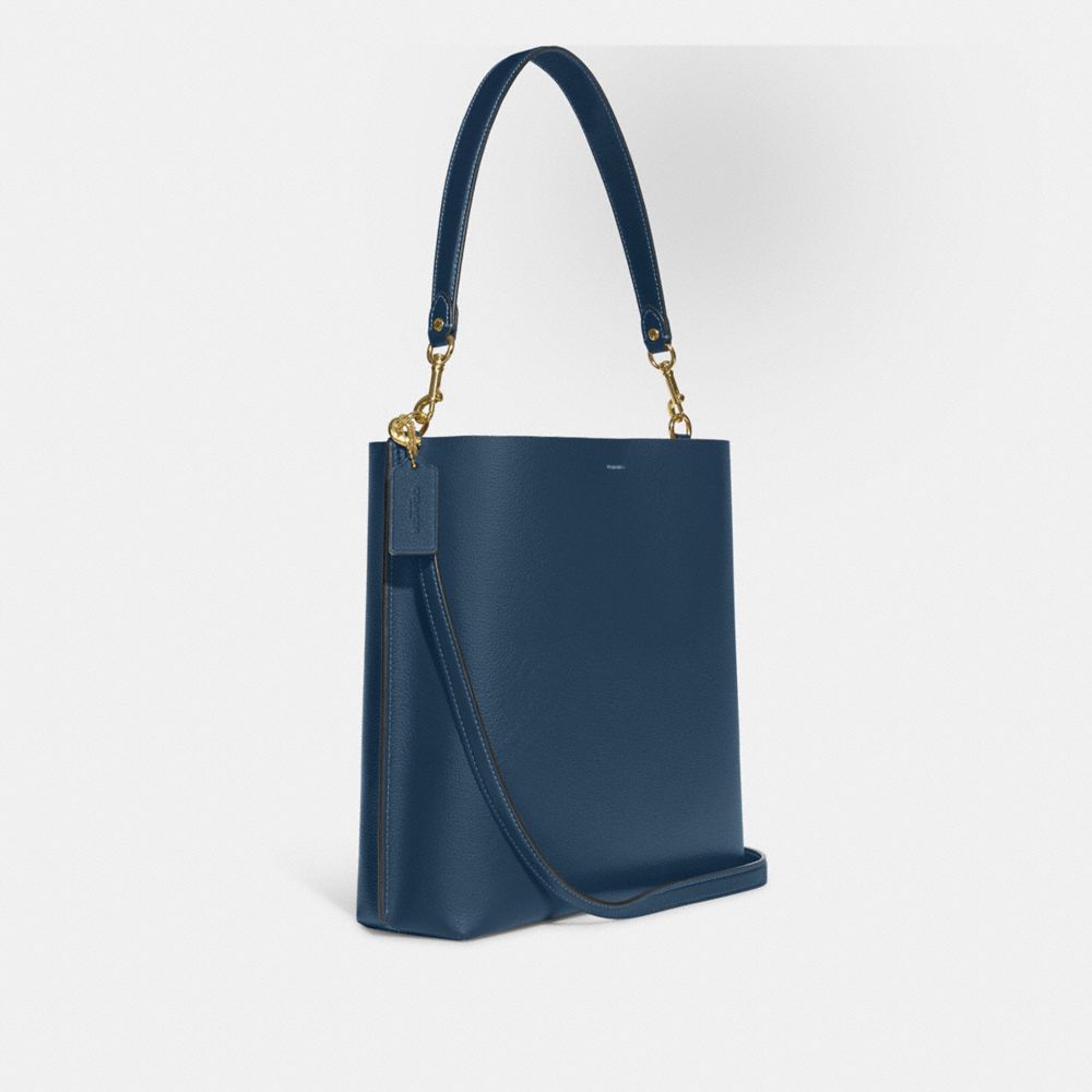 COACH®,MOLLIE BUCKET BAG,Pebbled Leather,Large,Gold/Denim,Angle View